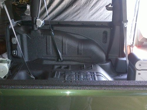 Spray Bed Lining for the Interior of a 2012 Green Jeep Wrangler